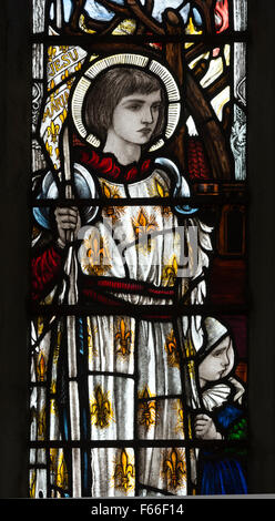 Saint Joan of Arc stained glass by Christopher Whall, St. Leonard`s Church, Apethorpe, Northamptonshire, England, UK Stock Photo